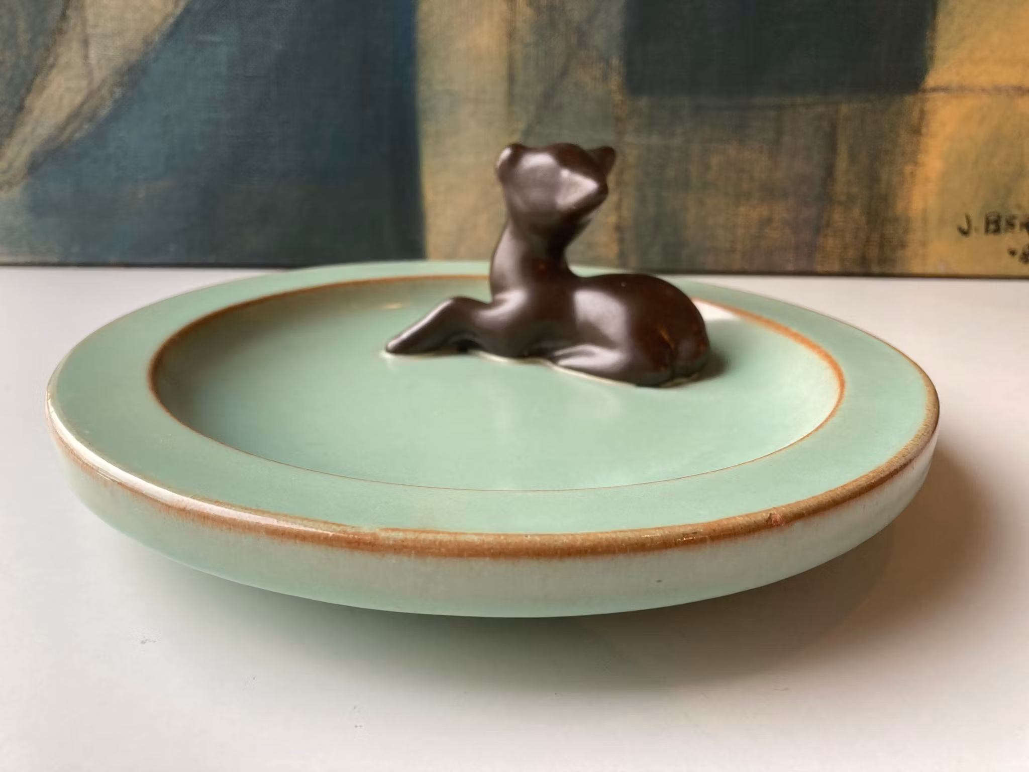 Brown deer in green ashtray 46