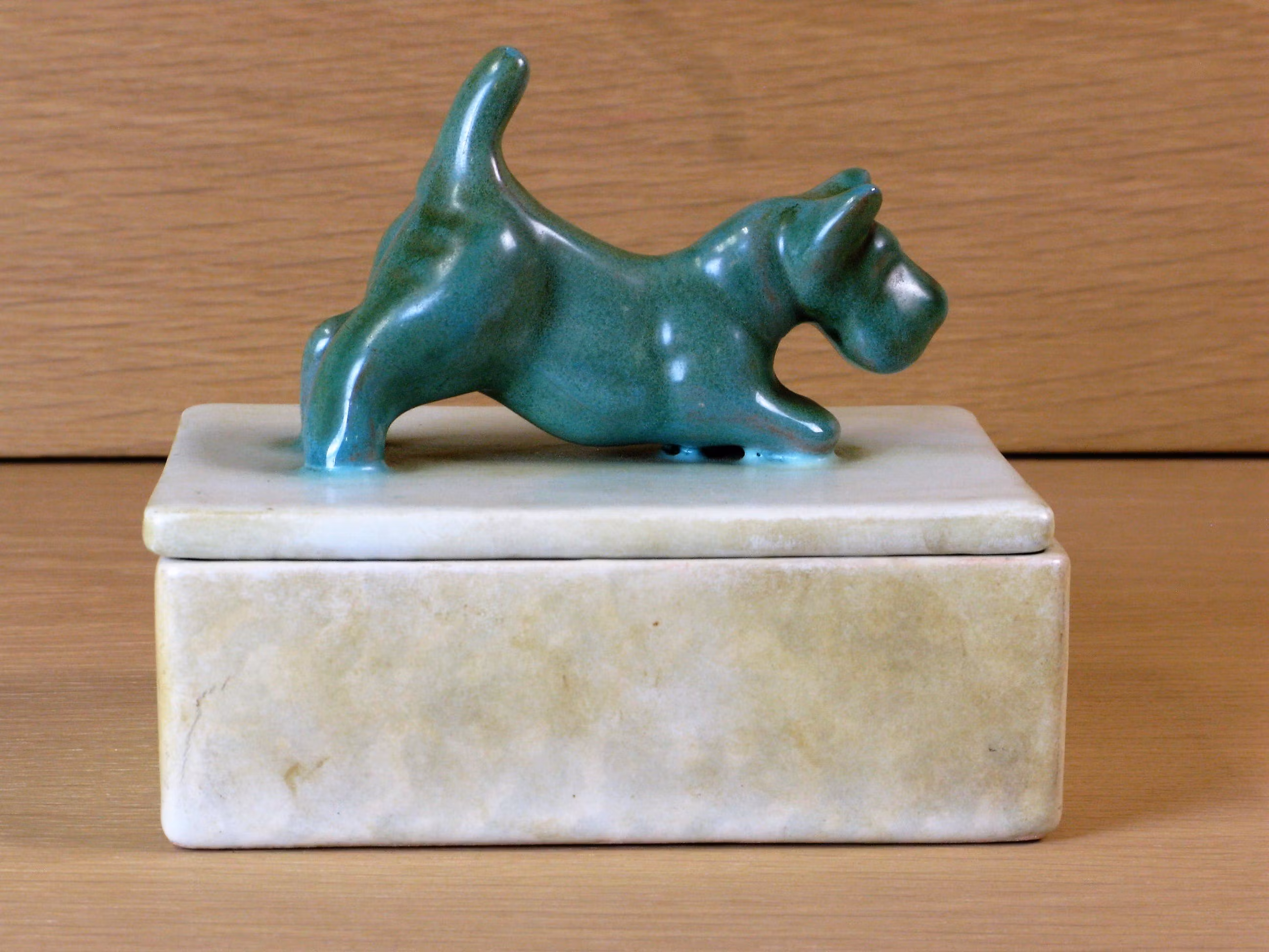 Green dog on a box 2
