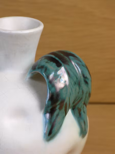 white vase with green handles 190