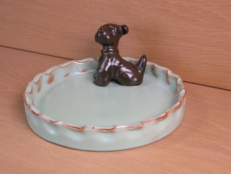 brown dog in green ashtray 12