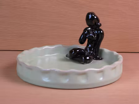 brown lady in green ashtray 12