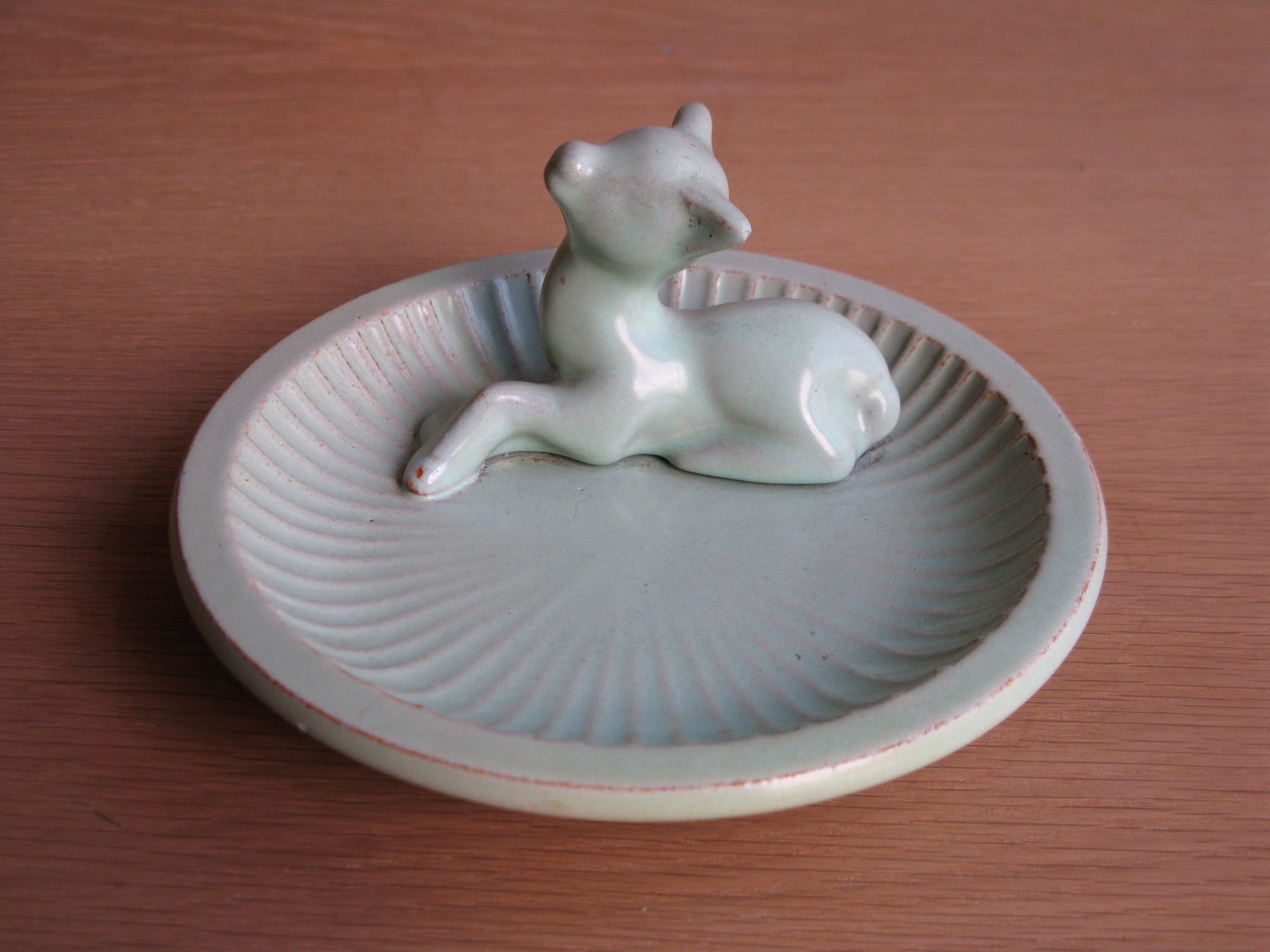 green deer in green ashtray 48