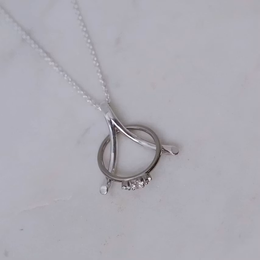 "Wishbone" ring holding necklace in silver