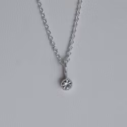 "Twinkle" pendant in silver with a light pink sapphire