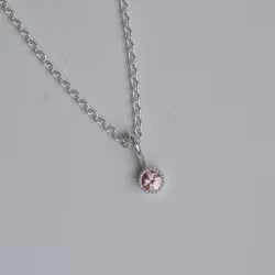 "Twinkle" pendant in silver with a peachpink sapphire