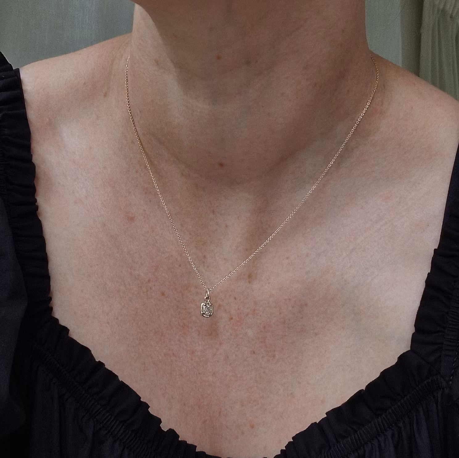 "Raw" pendant with a raw diamond