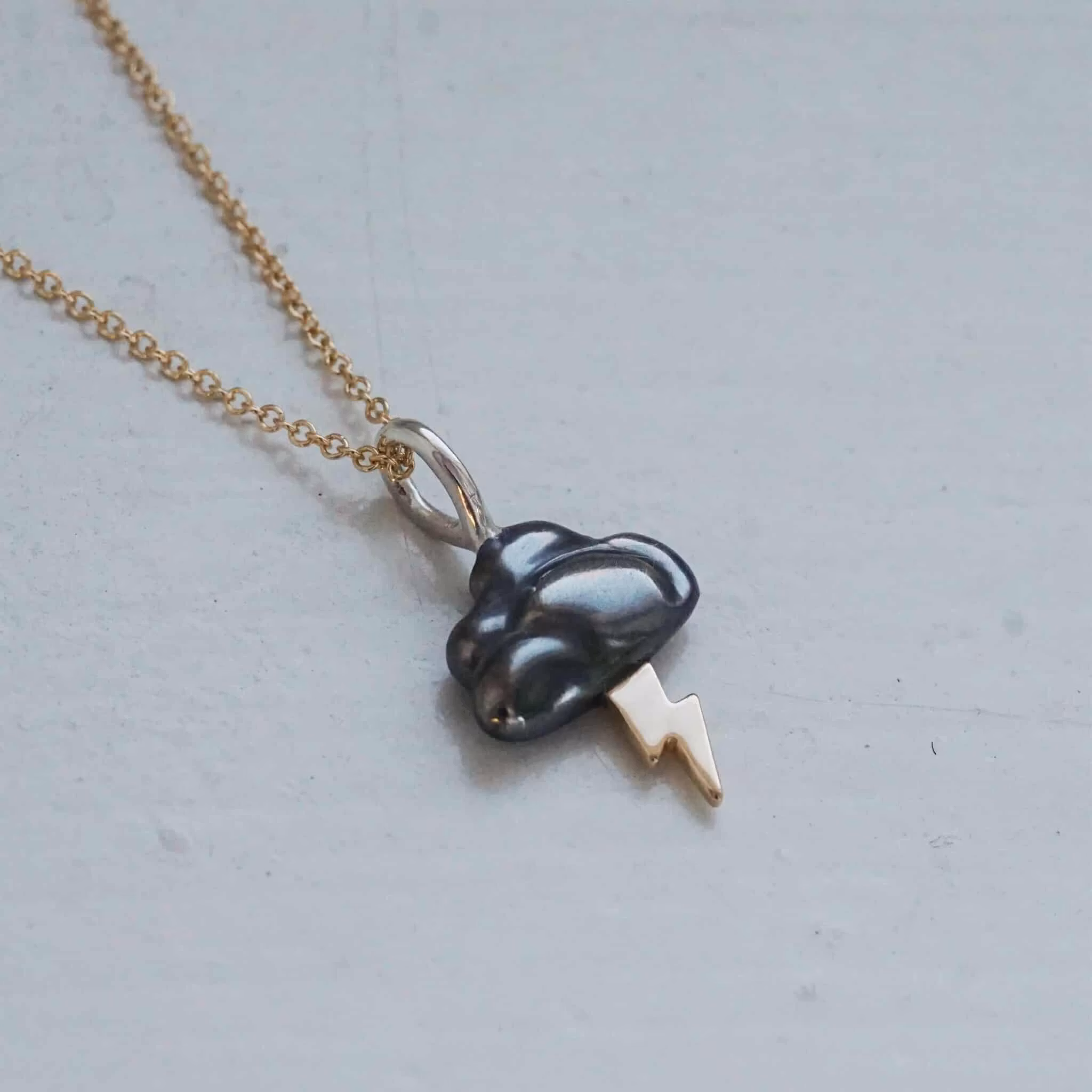 "Thundercloud" pendant in silver with gold lightning