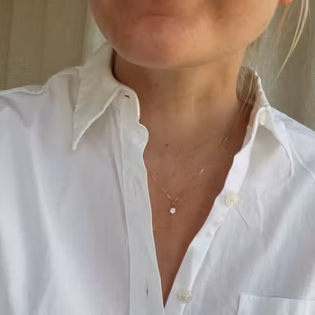 "Swedish Ice" pendant in gold with crystal quartz from Jämtland