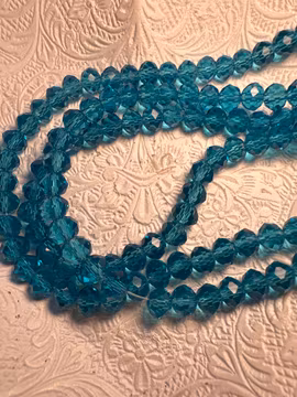 6 mm facetterad pärla på sträng 1st