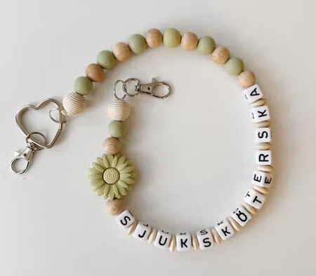 Nyckelkedja, grön blomma