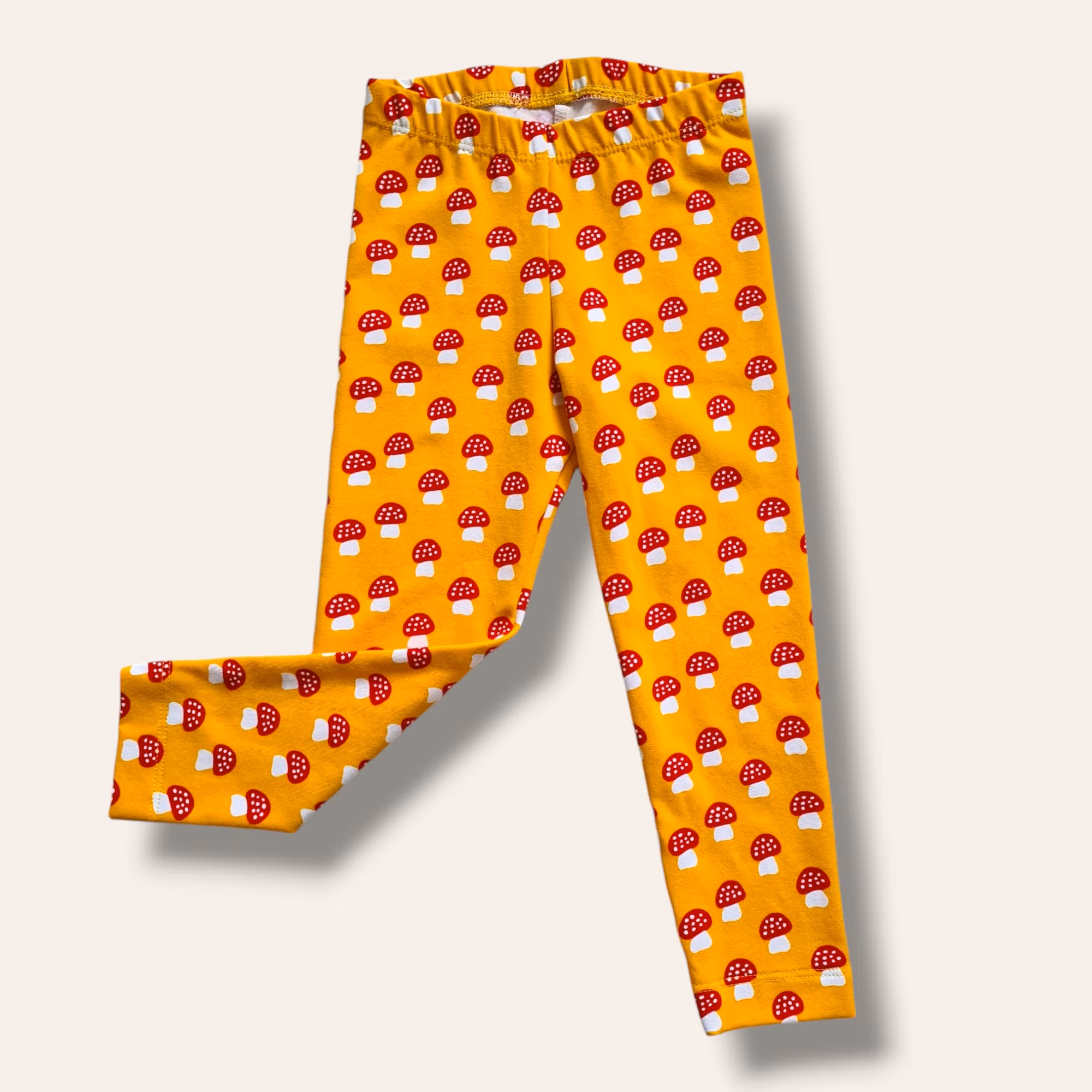 Gula leggings med flugsvampar - storlek 86/92