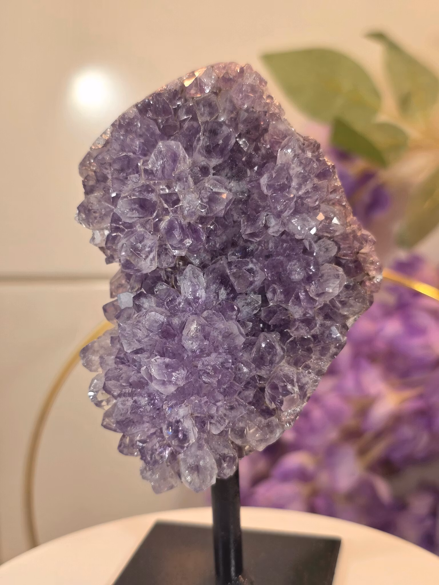 Amethyst cluster on stand with light purple tone and pineapple-shaped crystals from Brazil