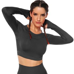 Svart Crop Top Träningstopp seamless med långa armar.