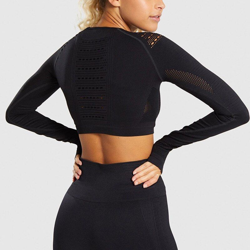 Svart Crop Top Träningstopp seamless med långa armar.
