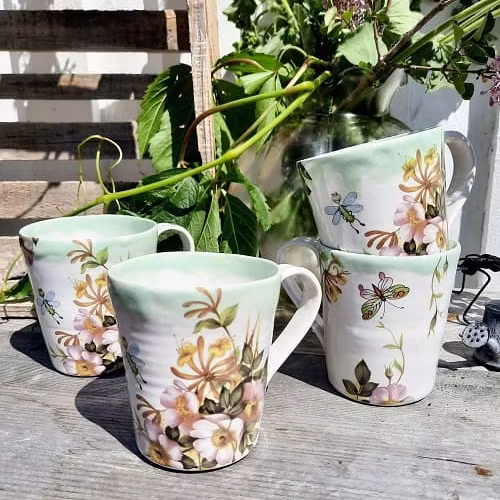 KAFFEMUGG MED SAGOLIKT MOTIV