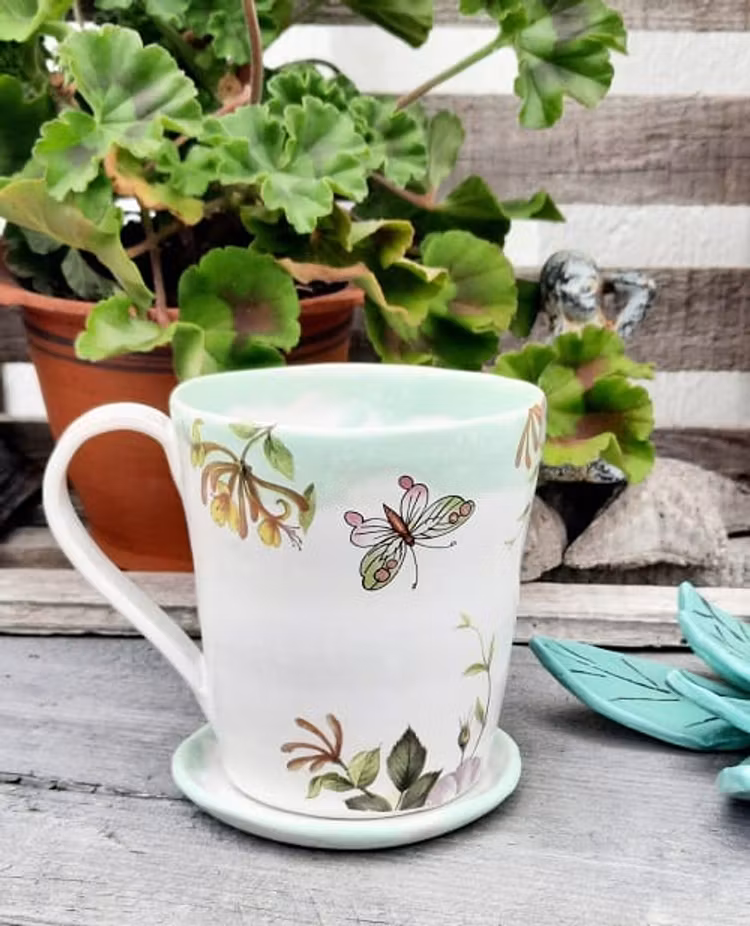 KAFFEMUGG MED SAGOLIKT MOTIV