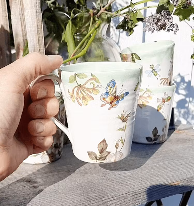 KAFFEMUGG MED SAGOLIKT MOTIV
