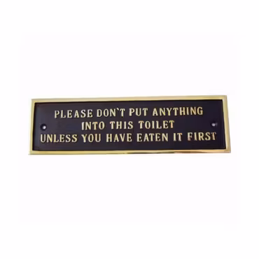 Tjock metallskylt med text ”toilet..."