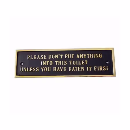 Tjock metallskylt med text ”toilet..."
