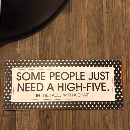 Metallskylt med text "Some people..."