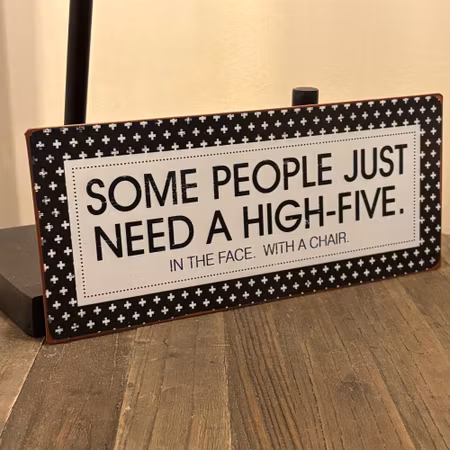 Metallskylt med text "Some people..."