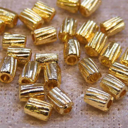 Mellandel, räfflad cylinder, guld
