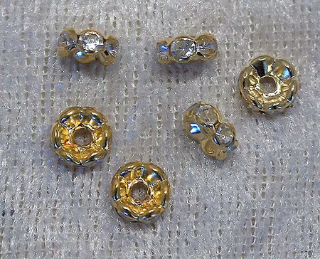 Strassmellandel, rondell, transparent/guldfärgad, 6 mm