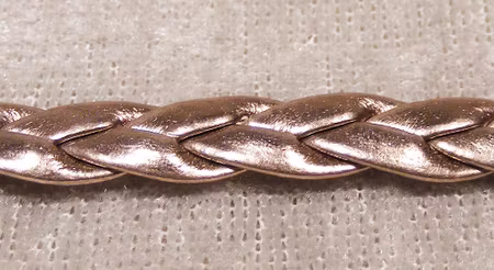 Flätad konstläderrem, metallisk brons/nougat
