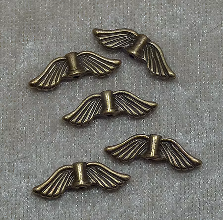 Änglavingar, antikbrons