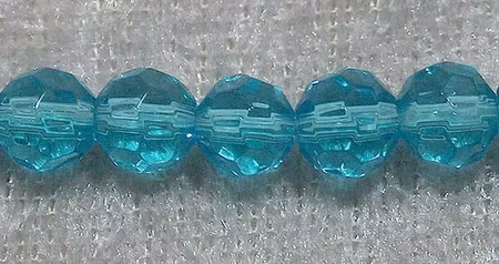 Facetterad rund kristallpärla, Turkos, 6 mm