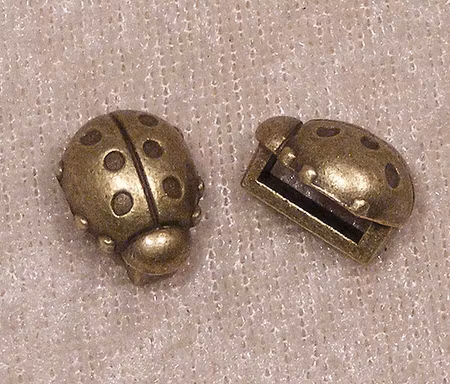 Mellandel, för platt rem, nyckelpiga, antikbrons