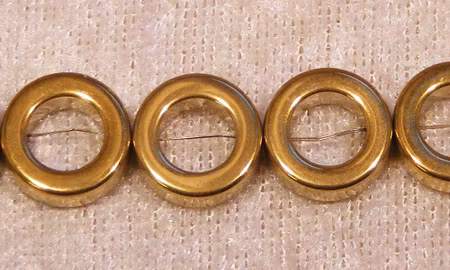 Donut, Ringar i hematit, 12x12x4 mm, elektropläterade i guldfärg
