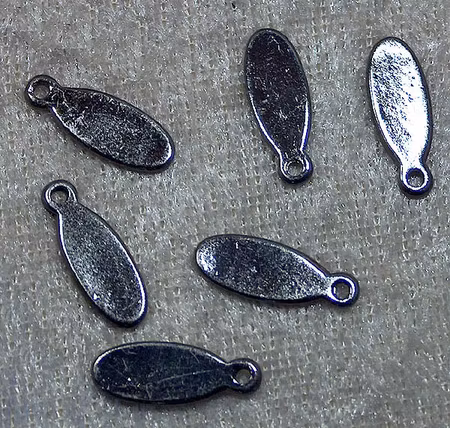 Oval tag, svartpläterad, 6x16x1 mm