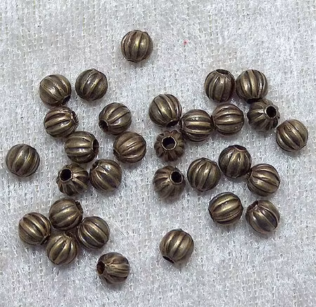 Melonpärlor, antikbrons, 5 mm