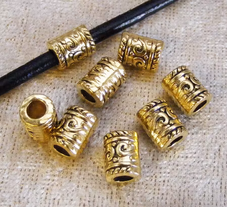 Mellandel, antikguld, mönstrad cylinder, stort hål