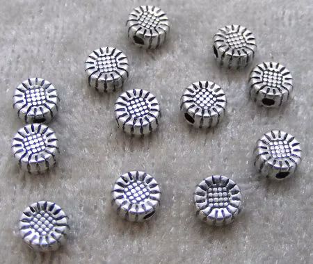 Mellandel, liten blomma, antiksilver