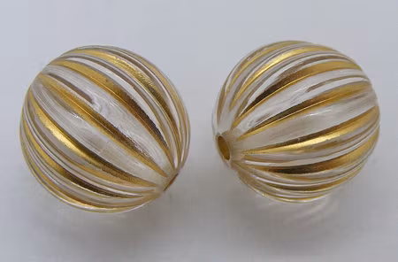 Akrylpärla, räfflad rund, transparent/guld