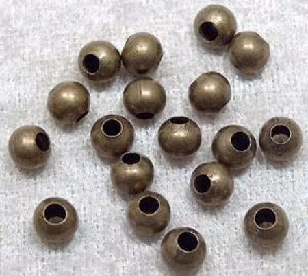 Rund bronsfärgad metallpärla, 6 mm