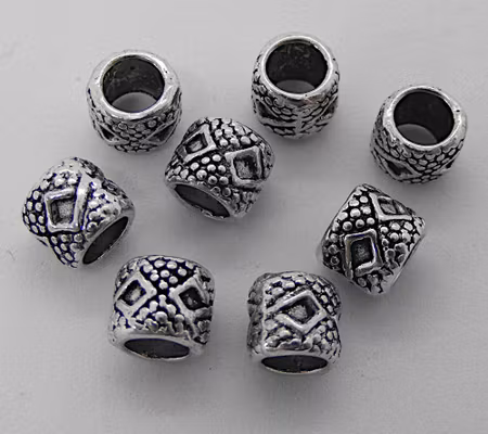Mellandel m stort hål, cylinder m prickar o romber, antiksilver