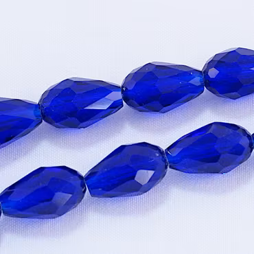 Facetterad glasdroppe, kungsblå, 15x10 mm