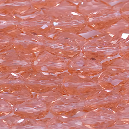 Facetterad glasdroppe, laxrosa, 15x10 mm