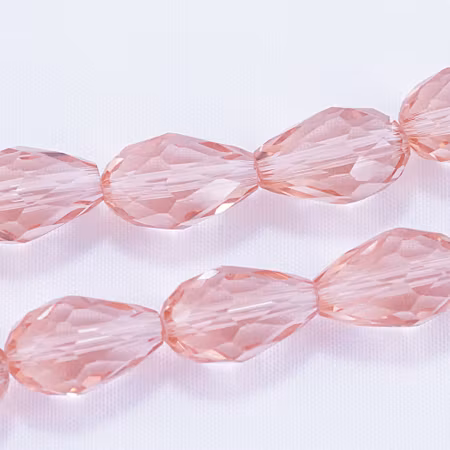 Facetterad glasdroppe, laxrosa, 15x10 mm