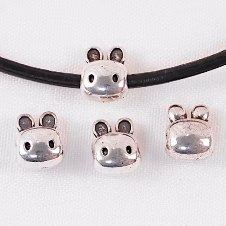 Mellandel, kaninhuvud, antiksilver